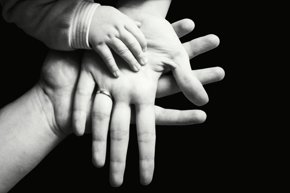 Hands of a family black and white