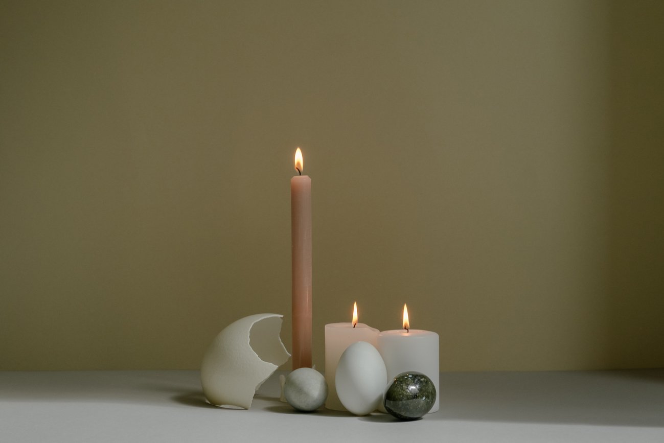 Lighted Candles and Stones